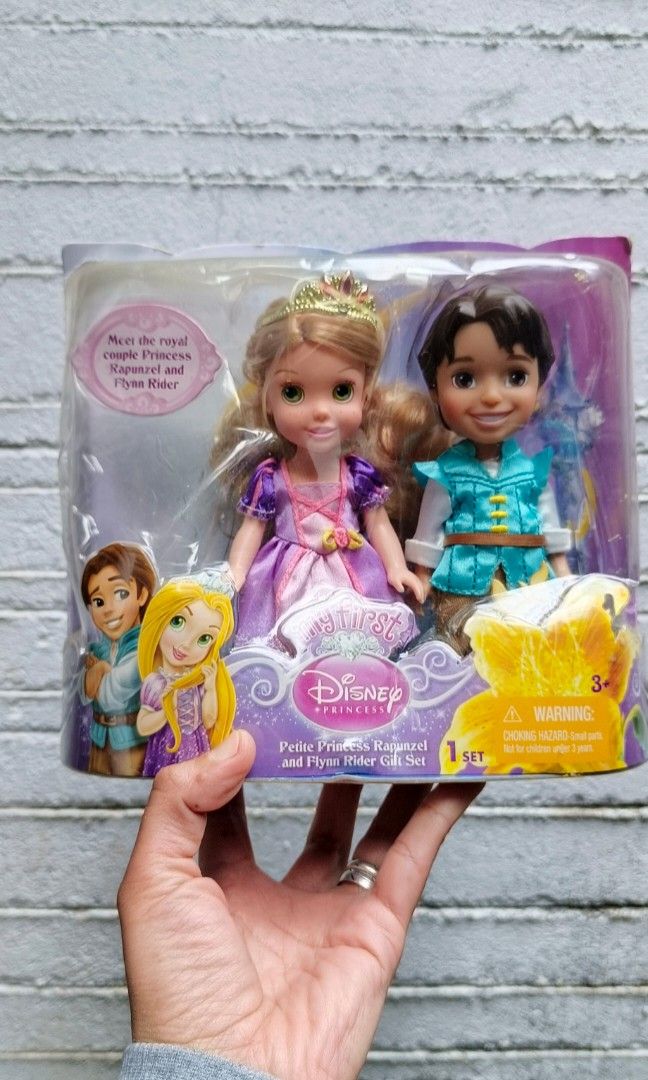 Rapunzel and Flynn (Category: Figurines & Statues) located in Baguio. Submitted by ukay_district (Listing ID 1334480565, Image 1). Description: Disney dolls Rapunzel and Flynn damaged box but dolls are still sealed 480.