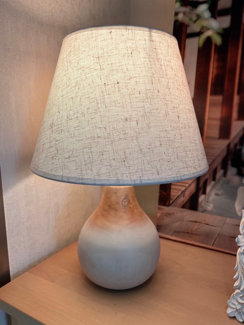 Scandinavian wooden lamp with linen lampshade (Category: Lighting) located in Singapore. Submitted by victoria.07 (Listing ID 1334393233, Image 2). Description: Able to adjust the shade of the light (comes with brand new Xiaomi LED smart light bulb) .