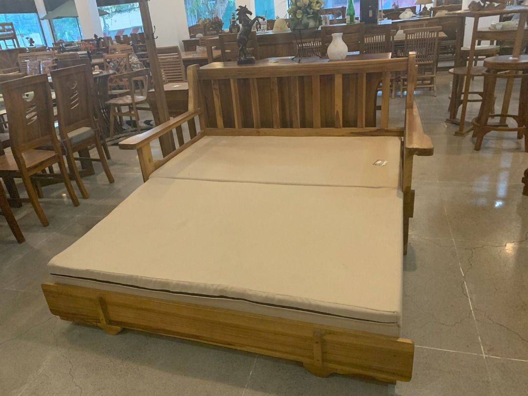 Solid Teak Wood Sofa Bed Furniture (Category: Sofas) located in Caloocan City. Submitted by anntinemaddelaaa00 (Listing ID 1334387458, Image 1). Description: ITEM: Handcrafted Solid Teak Wood Sofa Bed Furniture SERIES: Gold Teak (Indoor Series) MAIN MATERIAL: Teak Wood (Tectona Grandis) FINISHING: N. Cellulose APPROXIMATE DIMENSIONS: (size may slightly vary due to its handcrafted nature) Sofa Form: 160 x 93 x 90 cm Bed Form: 160 x 180 x 90 cm PAC