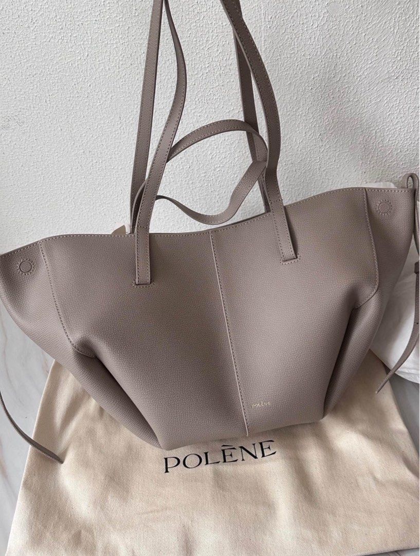 Cyme mini (Category: Luxury Bags & Wallets) located in Quezon City. Submitted by jaziman20249087 (Listing ID 1334590538, Image 1). Description: Brand new Polene Cym€ mini in taupe Italian textured calf leather, with a removable zippered pouch Magnetic closure Includes dustbag and box Can be worn two days: Basket-style, with its sides open, or closed bag, with the sides tucked in Worn as a handbag, elbow bag, or shoulder bag Dimensions: Measuremen