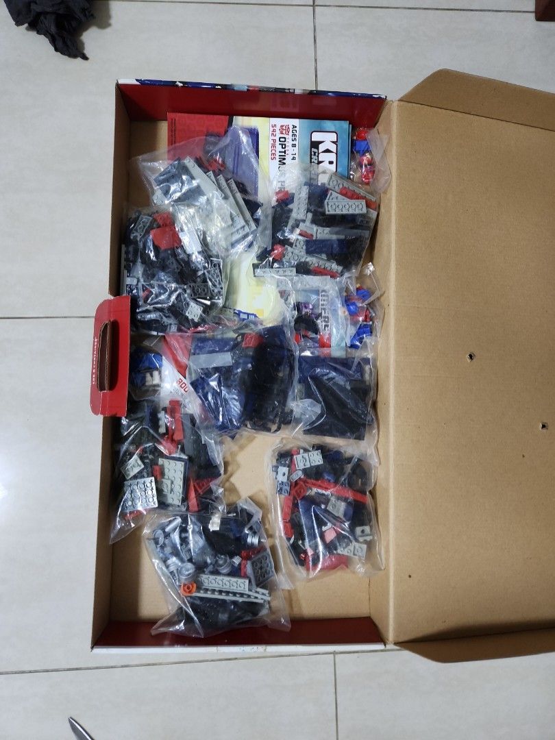 KRE-O OPTIMUS TRANSFORMERS (Category: Lego & Building Sets) located in Singapore. Submitted by mayatan19 (Listing ID 1334498708, Image 6). Description: lego unpack in box . new vintage bought at $380 . 3 in 1 Optimus Prime Transformers . 542 pieces lego original brand.