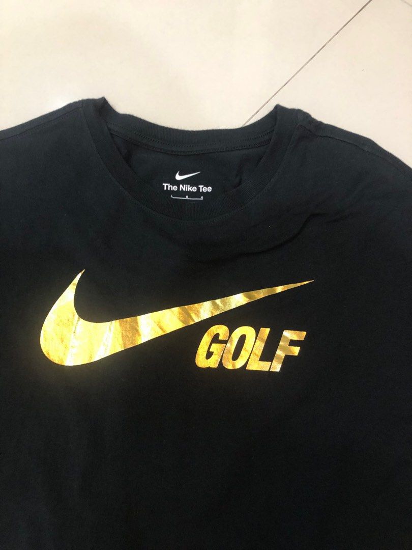 black nike shirt with gold swoosh