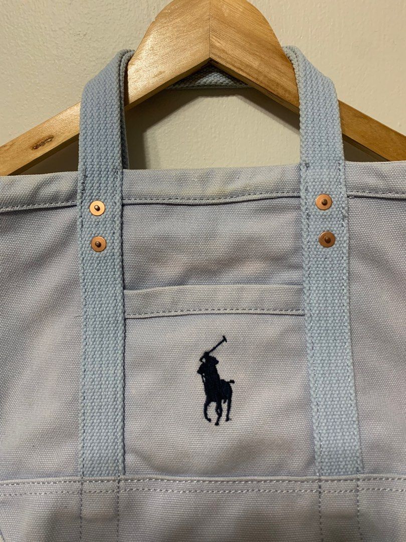 Ralph Lauren Mini Hundle Tote bag! (Category: Tote Bags) located in Olongapo. Submitted by studiogarments (Listing ID 1334499259, Image 2). Description: Ralph Lauren Hundle bag! Baby blue color way -Good Condition -Color rate 9/10 -Minimal Signs of Usage -Legit/ Authentic! -Need wash only ₱ 580 + Shipping Fee! PLEASE READ CAREFULLY! CLICK EACH PHOTO FOR MORE DETAIL! 📌Corrier: JNT EXPRESS 📌MOP: Gcash/ Cebuana/ Metrobank ⚠️Colors may very due to 