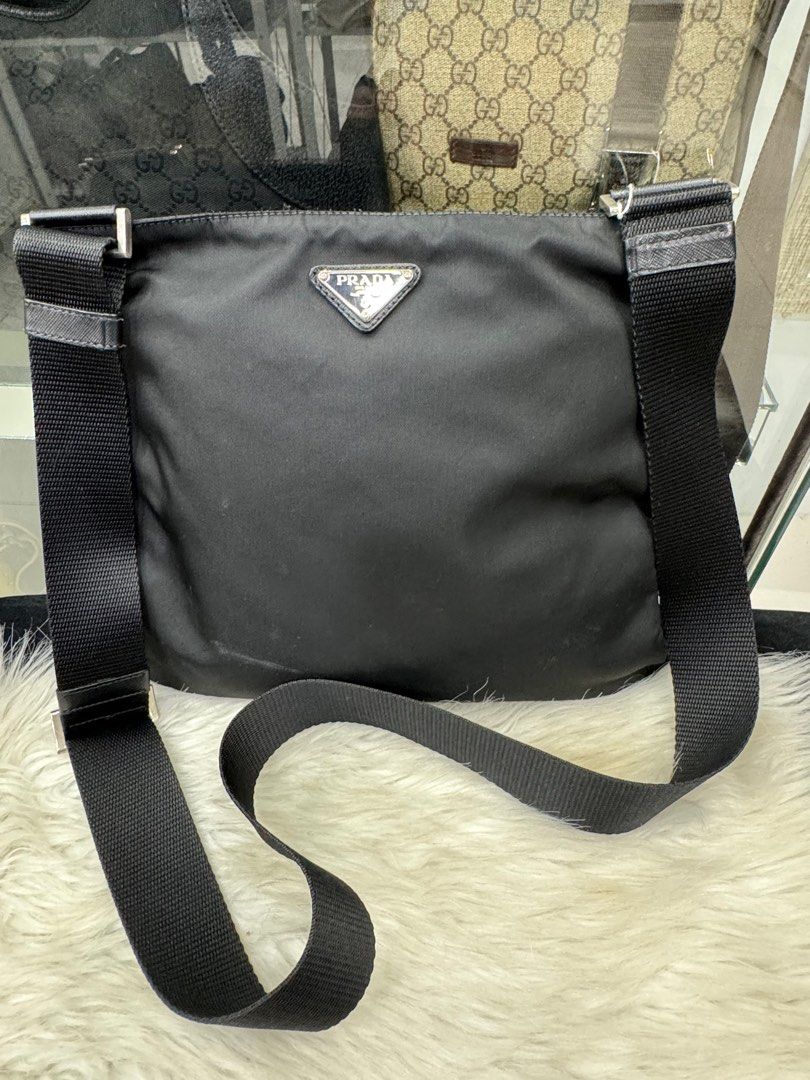 Authentic Prada Bag (Category: Luxury Bags & Wallets) located in Manila. Submitted by chloe_luxuries (Listing ID 1334839832, Image 1). Description: Guaranteed original Prada nylon sling bag Still in good condition with mild scratches in front of the bag Please zoom in pics No inclusion bag only Pm for those interested.