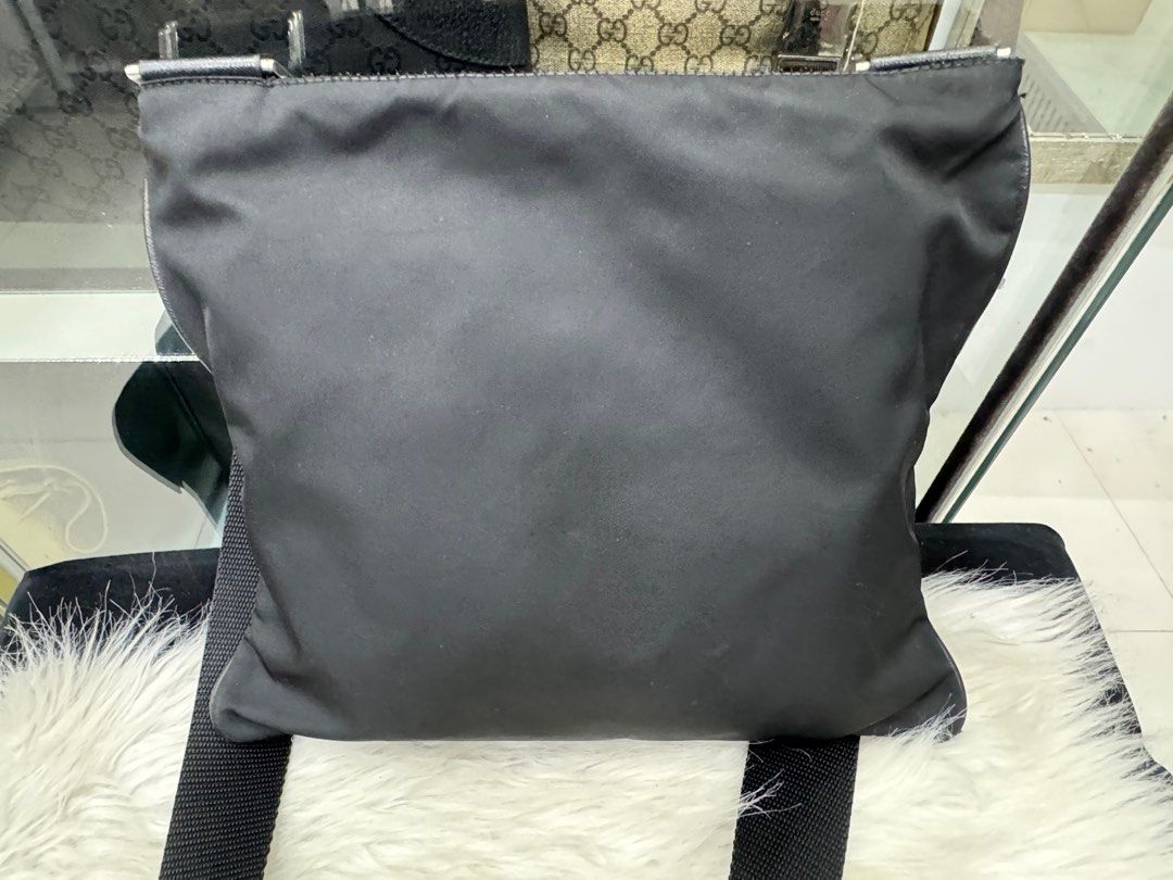 Authentic Prada Bag (Category: Luxury Bags & Wallets) located in Manila. Submitted by chloe_luxuries (Listing ID 1334839832, Image 2). Description: Guaranteed original Prada nylon sling bag Still in good condition with mild scratches in front of the bag Please zoom in pics No inclusion bag only Pm for those interested.