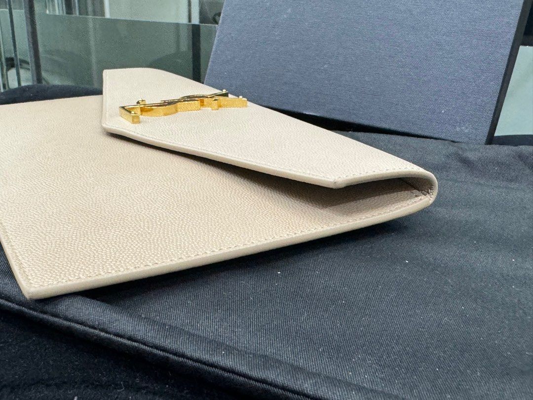Authentic Ysl (Category: Luxury Bags & Wallets) located in Manila. Submitted by chloe_luxuries (Listing ID 1334843136, Image 3). Description: Guaranteed original Ysl Clutch Still in excellent condition good as new Comes with cards and box Pm for more details.
