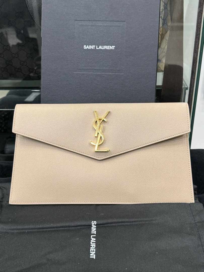 Authentic Ysl (Category: Luxury Bags & Wallets) located in Manila. Submitted by chloe_luxuries (Listing ID 1334843136, Image 1). Description: Guaranteed original Ysl Clutch Still in excellent condition good as new Comes with cards and box Pm for more details.