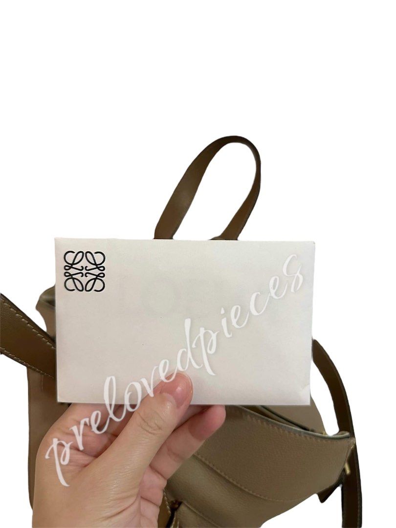 Guaranteed Authentic Loewe Small Hammock Bag in Soft Grained Calfskin (Category: Luxury Bags & Wallets) located in Taguig. Submitted by wanderandco (Listing ID 1334838708, Image 2). Description: Guaranteed Authentic/Original, you name it. I'll triple your money back if proven otherwise. Inclusions are in the photo posted. Lightly used as you can see from the condition of the bag. DM for serious buyer only..