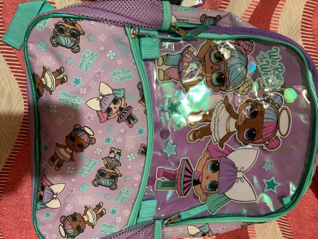 L.O.L. Backpack, lunch bag & drawstring (Category: Backpacks) located in Antipolo. Submitted by ryse2 (Listing ID 1334731433, Image 2). Description: Backpack and drawstring - never used Lunch bag - clean but with signs of usage.