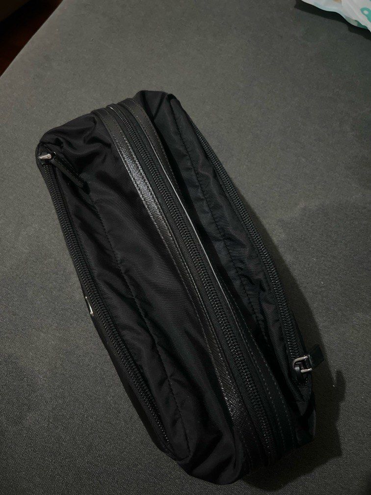 Prada Nylon Clutch Bag (Category: Luxury Bags & Wallets) located in Quezon City. Submitted by mgeloo (Listing ID 1334851061, Image 3). Description: Selling my Prada Nylon Clutch Bag that was purchased in Japan. I can show a picture of the receipt. RFS: don’t get to use it much .