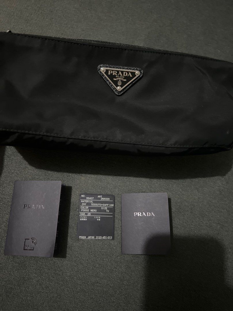 Prada Nylon Clutch Bag (Category: Luxury Bags & Wallets) located in Quezon City. Submitted by mgeloo (Listing ID 1334851061, Image 2). Description: Selling my Prada Nylon Clutch Bag that was purchased in Japan. I can show a picture of the receipt. RFS: don’t get to use it much .