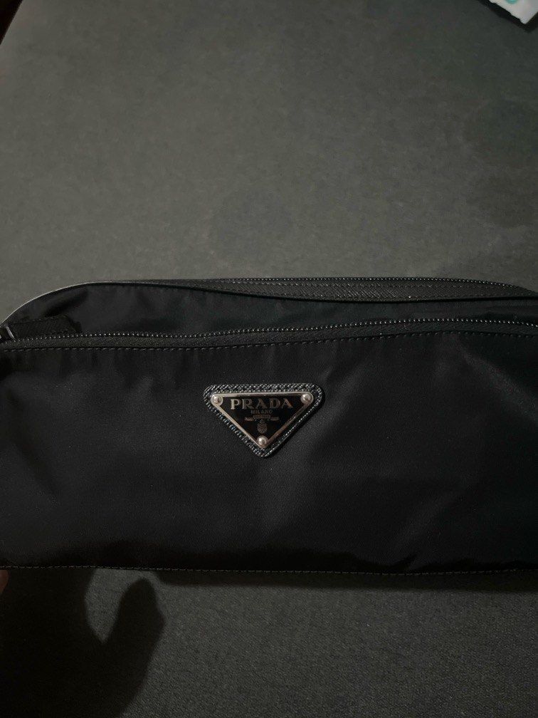 Prada Nylon Clutch Bag (Category: Luxury Bags & Wallets) located in Quezon City. Submitted by mgeloo (Listing ID 1334851061, Image 1). Description: Selling my Prada Nylon Clutch Bag that was purchased in Japan. I can show a picture of the receipt. RFS: don’t get to use it much .