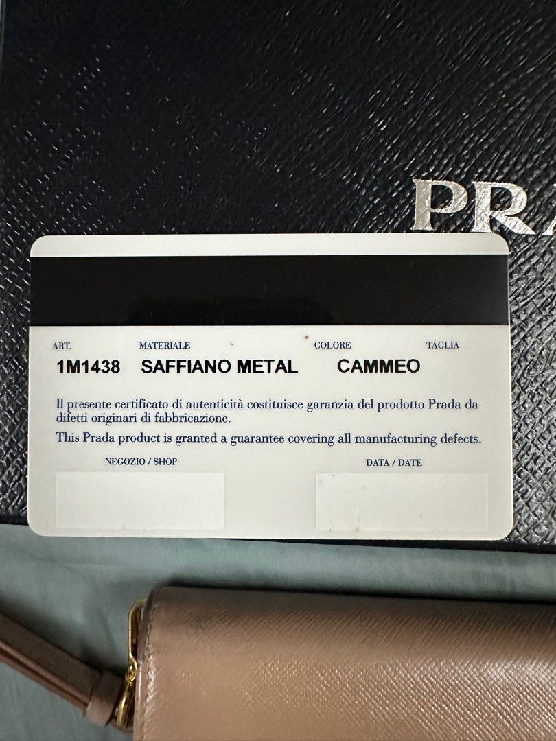 Prada Wristlet (Category: Luxury Bags & Wallets) located in Quezon City. Submitted by juliaatherese (Listing ID 1334729687, Image 3). Description: Shows signs of usage and cloth at back zipper ripped. Refer to last photo for issue..