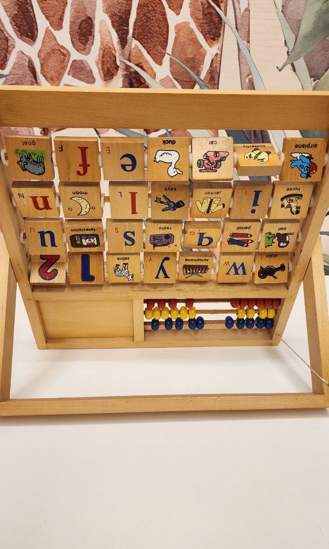 wooden alphabet with abacus and clock (Category: Educational & Learning Toys) located in Manila. Submitted by wardrobemanila (Listing ID 1334804124, Image 3). Description: wooden alphabets, abacus and clock. Montessori toys. Opened then kept inside the cabinet. Like new condition rfs: decluttering.