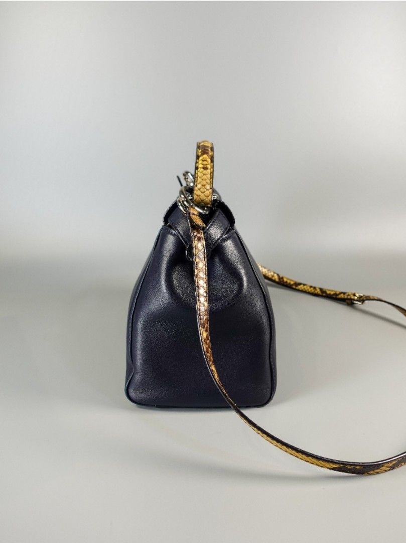 Fendi Mini Peekaboo in Navy Blue Leather with Python Top Handle (Category: Luxury Bags & Wallets) located in Taguig. Submitted by pursemaison (Listing ID 1335068843, Image 2). Description: Fendi Mini Peekaboo in Navy Blue Leather with Python Top Handle ✨Php 70,000 *Additional 4% for straight credit card payments *Available for 4 months layaway with 1% interest per month *BDO credit card up to 36 mos & Citibank credit card up to 24 mos (with inter