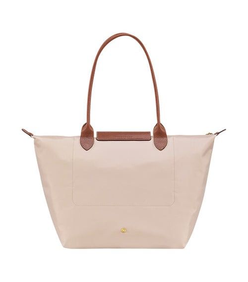 Longchamp Le Pliage Long Handle Large (Category: Luxury Bags & Wallets) located in Siniloan. Submitted by easyaonlinestore (Listing ID 1335011982, Image 3). Description: Longchamp Le Pliage Long Handle Large in Paper 💯 Brand new 💯 Original Comes with paperbag and care card. 6700.00php + SF 📍Bulacan MOP: Gcash | Paymaya I Bank Transfer.