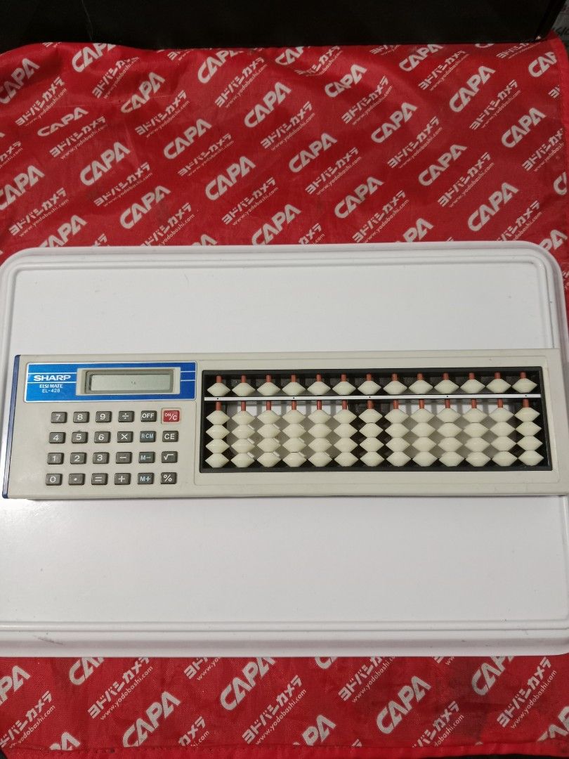 VINTAGE Abacus with calculator (SHARP ELSI MATE EL-428) (Category: Office & Business Technology) located in Tabaco. Submitted by fritznicoleshoppe (Listing ID 1334900671, Image 1). Description: VINTAGE Abacus with calculator (SHARP ELSI MATE EL-428). Hybrid Retro item. The calculator is working. Issue: battery slot has no cover. with FREE battery selling as is *buyer can also avail the FREEBIES listed.