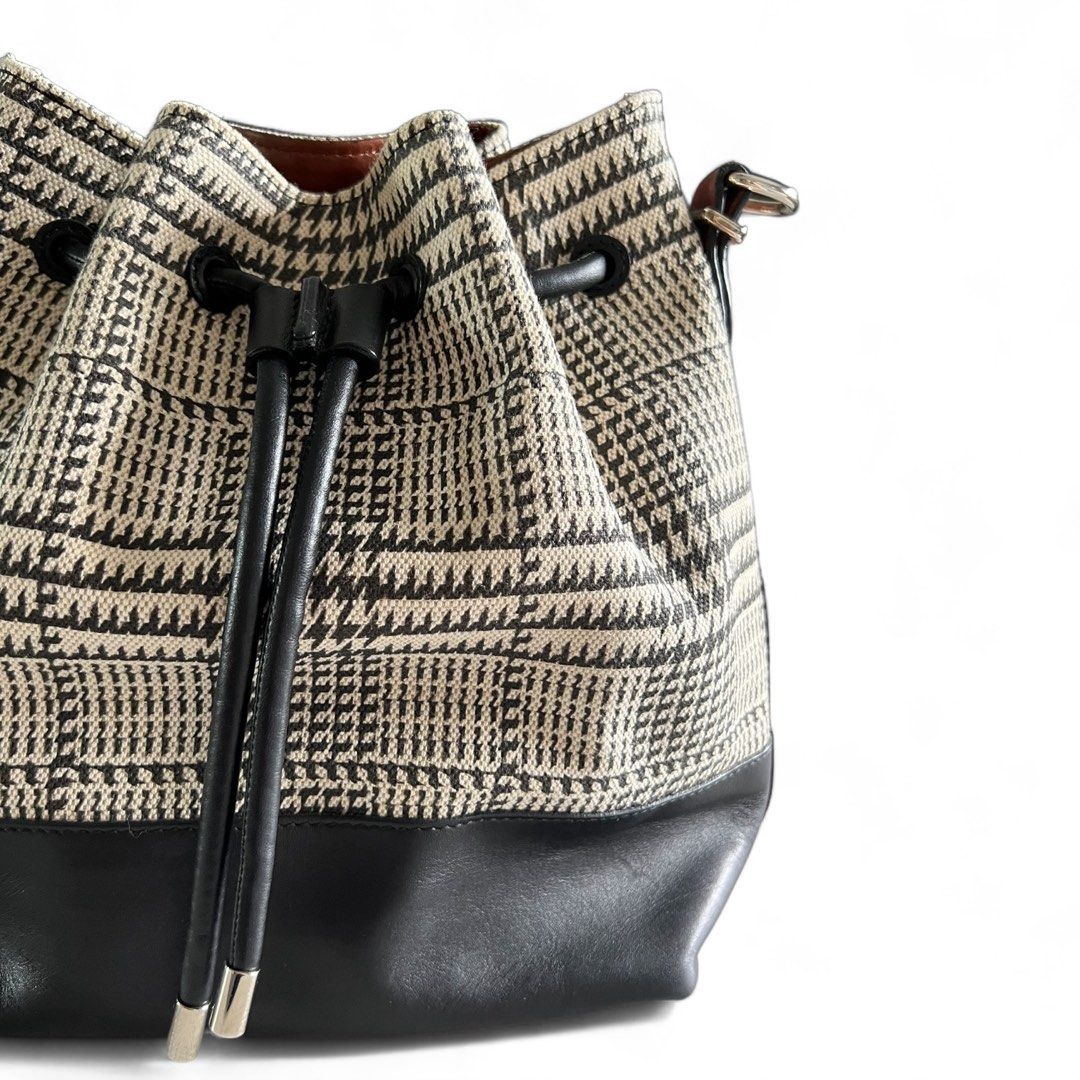 PROENZA SCHOULER Houndstooth Bucket Bag (Category: Luxury Bags & Wallets) located in Davao. Submitted by allthisandmore (Listing ID 1335173827, Image 3). Description: Inclusion: - Removable Pouch - Dust Bag - Care Card Approximately: Width: 21.5cm | Height: 25cm | Depth: 13cm Material: 100% Leather & Fabric Made in Italy .