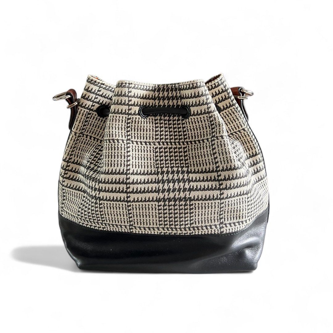 PROENZA SCHOULER Houndstooth Bucket Bag (Category: Luxury Bags & Wallets) located in Davao. Submitted by allthisandmore (Listing ID 1335173827, Image 2). Description: Inclusion: - Removable Pouch - Dust Bag - Care Card Approximately: Width: 21.5cm | Height: 25cm | Depth: 13cm Material: 100% Leather & Fabric Made in Italy .