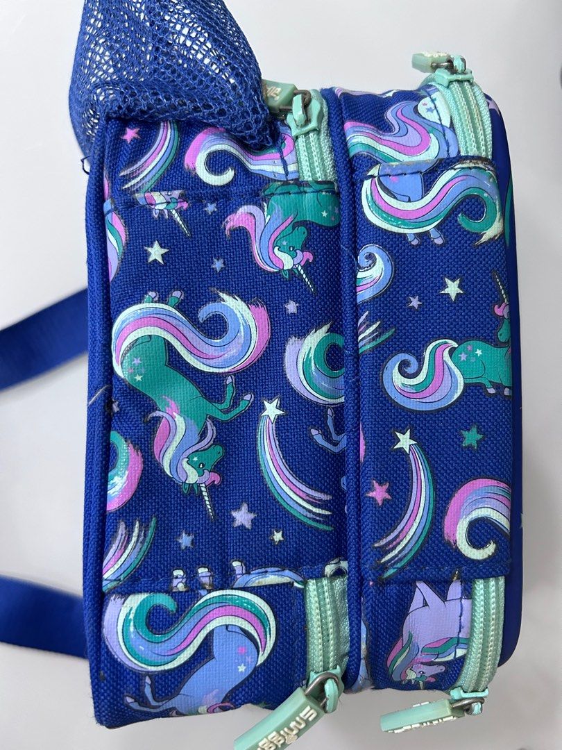 Smiggle Hardtop Lunchbox with Strap (Category: Diaper Bags & Wetbags) located in Singapore. Submitted by autumncapybara (Listing ID 1335120578, Image 4). Description: Protect lunchtime goodies with Smiggle Hardtop Lunchbox! It has insulated lining, a two-tiered design to separate lunch from snacks and an adjustable and removable shoulder strap. For lunchtime hydration, keep a drink bottle handy in the convenient bottle sleeve! BPA free and food s