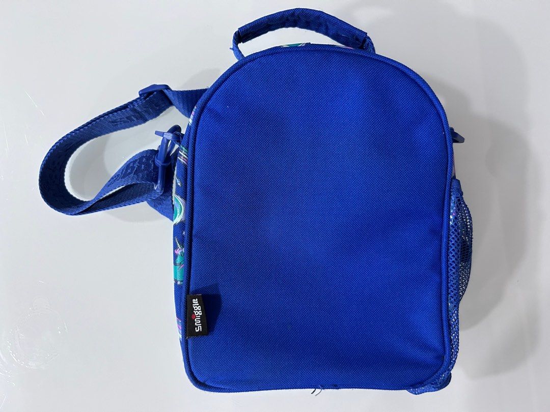 Smiggle Hardtop Lunchbox with Strap (Category: Diaper Bags & Wetbags) located in Singapore. Submitted by autumncapybara (Listing ID 1335120578, Image 2). Description: Protect lunchtime goodies with Smiggle Hardtop Lunchbox! It has insulated lining, a two-tiered design to separate lunch from snacks and an adjustable and removable shoulder strap. For lunchtime hydration, keep a drink bottle handy in the convenient bottle sleeve! BPA free and food s