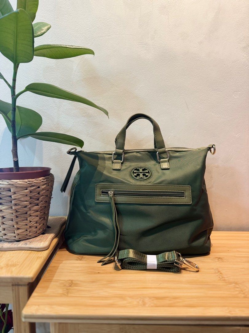 2way nylon bag (Category: Luxury Bags & Wallets) located in Quezon City. Submitted by margret.mathew (Listing ID 1335373482, Image 1). Description: Used only twice as handbag No flaws good as new Tessuto Nylon guaranteed water proof (same sa Prada nylon bags) Medium size 2way handle Army green color ☝️Go to my page for more decluttering items, follow to be notified 👍👍👍👍.