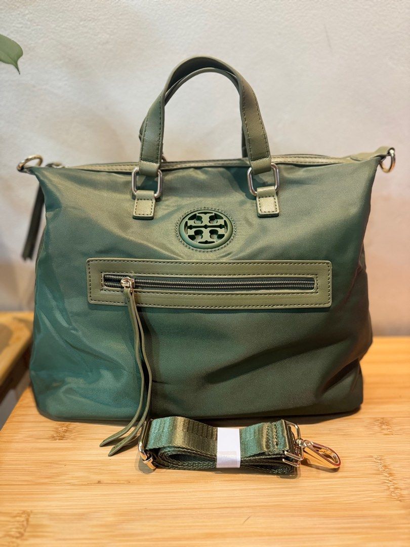 2way nylon bag (Category: Luxury Bags & Wallets) located in Quezon City. Submitted by margret.mathew (Listing ID 1335373482, Image 2). Description: Used only twice as handbag No flaws good as new Tessuto Nylon guaranteed water proof (same sa Prada nylon bags) Medium size 2way handle Army green color ☝️Go to my page for more decluttering items, follow to be notified 👍👍👍👍.