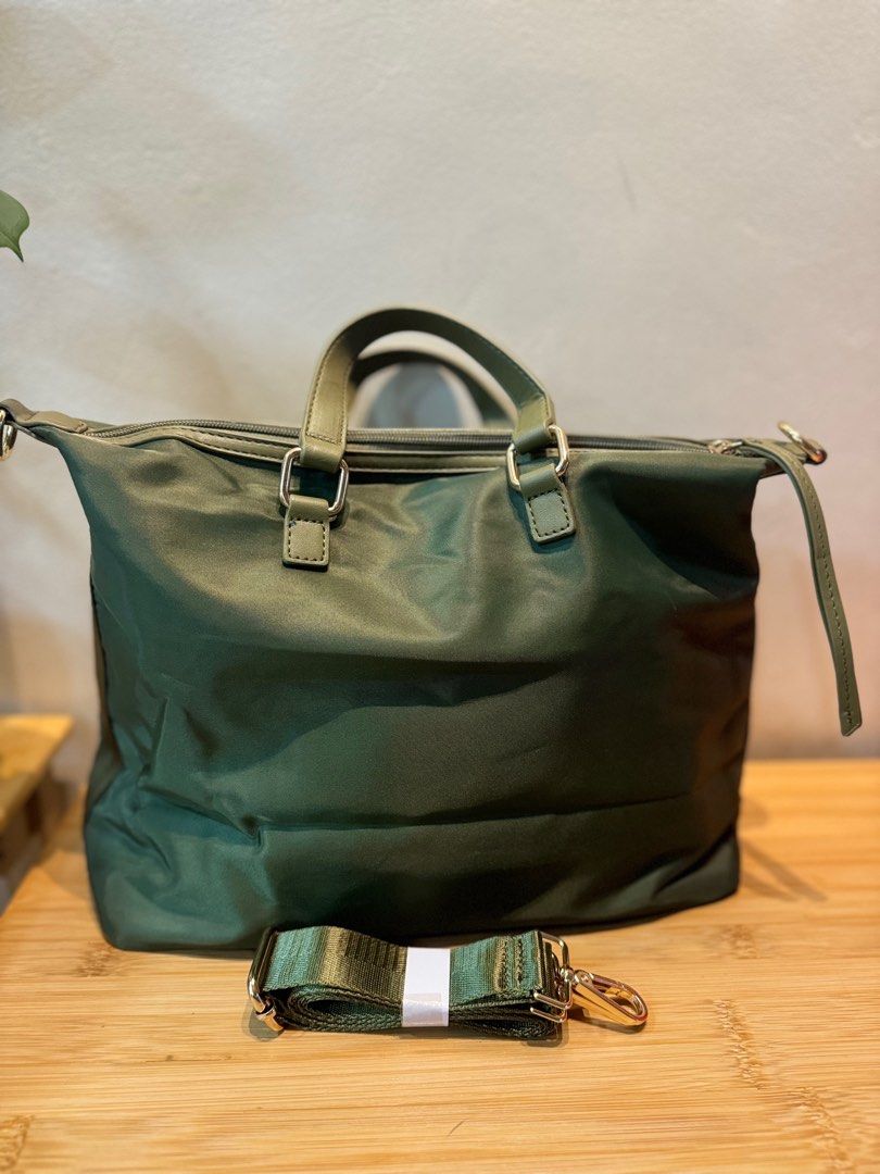 2way nylon bag (Category: Luxury Bags & Wallets) located in Quezon City. Submitted by margret.mathew (Listing ID 1335373482, Image 3). Description: Used only twice as handbag No flaws good as new Tessuto Nylon guaranteed water proof (same sa Prada nylon bags) Medium size 2way handle Army green color ☝️Go to my page for more decluttering items, follow to be notified 👍👍👍👍.