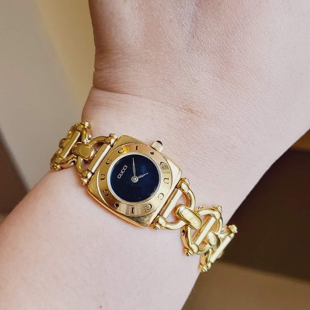 Gucci black and gold watch hot sale