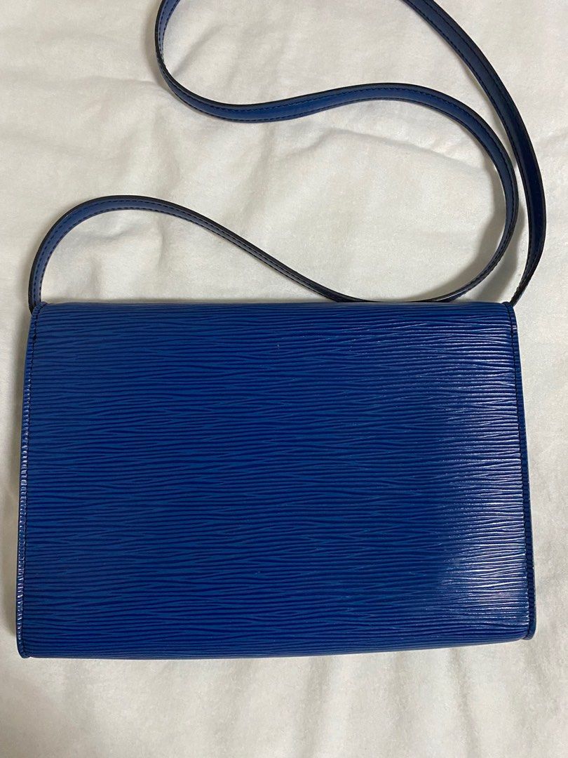 Louis Vuitton Epi Pochette Arche Shoulder Bag (Category: Luxury Bags & Wallets) located in Cebu City. Submitted by thedeclutteringmom (Listing ID 1335379637, Image 2). Description: Guaranteed original Money back if proven fake Vintage LV flap closure shoulder bag Epi in blue color Color is still very vibrant In very good condition With minimal dirt inside but outside is clean No leather tear or damage Sticky inside pocket Gold hardware, no tarnis