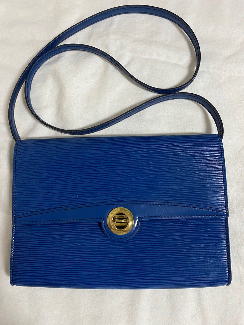 Louis Vuitton Epi Pochette Arche Shoulder Bag (Category: Luxury Bags & Wallets) located in Cebu City. Submitted by thedeclutteringmom (Listing ID 1335379637, Image 1). Description: Guaranteed original Money back if proven fake Vintage LV flap closure shoulder bag Epi in blue color Color is still very vibrant In very good condition With minimal dirt inside but outside is clean No leather tear or damage Sticky inside pocket Gold hardware, no tarnis