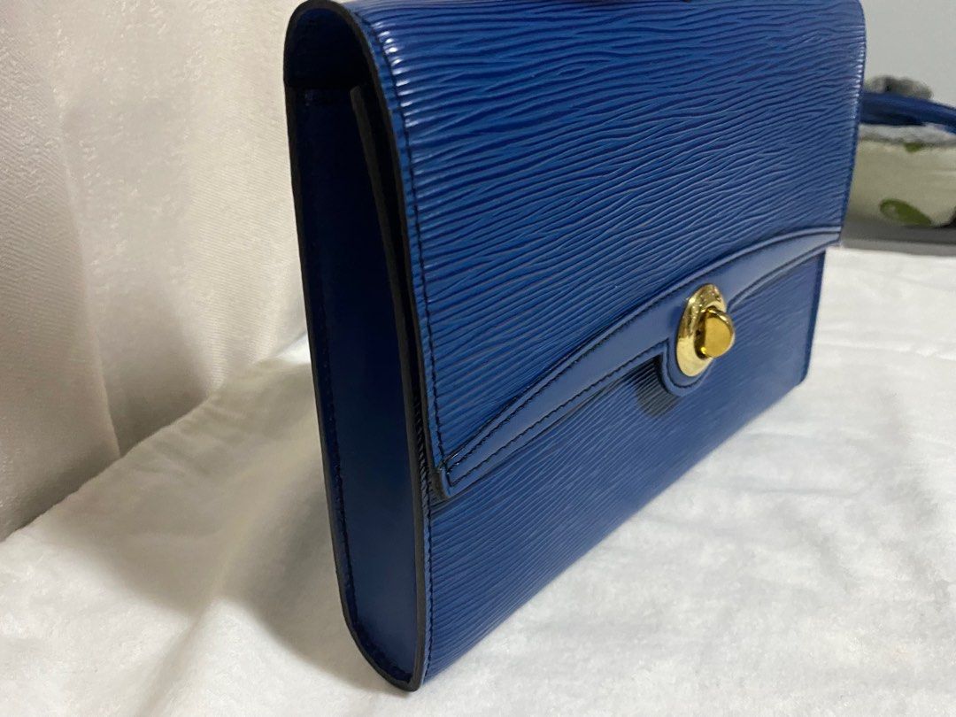 Louis Vuitton Epi Pochette Arche Shoulder Bag (Category: Luxury Bags & Wallets) located in Cebu City. Submitted by thedeclutteringmom (Listing ID 1335379637, Image 3). Description: Guaranteed original Money back if proven fake Vintage LV flap closure shoulder bag Epi in blue color Color is still very vibrant In very good condition With minimal dirt inside but outside is clean No leather tear or damage Sticky inside pocket Gold hardware, no tarnis