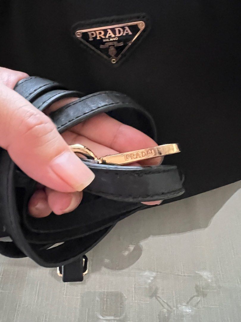 Prada Nylon Logo Jacquard (Category: Luxury Bags & Wallets) located in Indang. Submitted by lornacmtl (Listing ID 1335258735, Image 3). Description: Authentic Prada 2way bag with sling, authenticity card, zipper closure, 2 open pocket & 1 zip pocket, gold hardware, made in Italy (pls see posted pics)no major flaws just sign of used 13”x8”x4” Rfs: decluttering Payment thru Gcash & bank transfer.