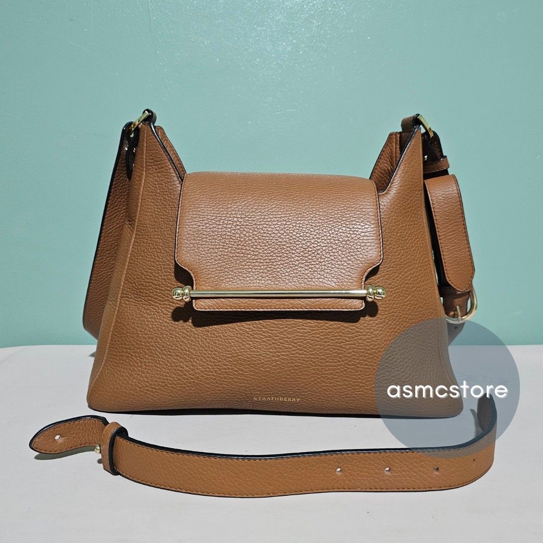 Strathberry Multress Midi Hobo bag in Caramel (Category: Luxury Bags & Wallets) located in Marikina City. Submitted by asmcstore (Listing ID 1335348913, Image 2). Description: Strathberry Multress Midi Hobo bag in Caramel Made in Spain has a short strap to be converted into a shoulder bag Depth: 10 cm Width: 31 cm Height: 25 cm Strap width: 2.5cm (1.0") **These are VINTAGE/PRELOVED bags signs of usage might be present** **Bags are cleaned and con