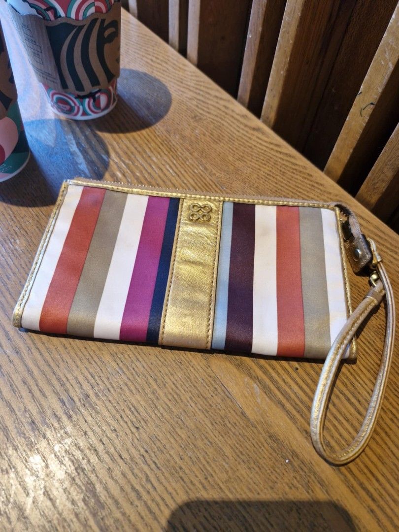 COACH multicolor clutch bag (Category: Luxury Bags & Wallets) located in Taguig. Submitted by starbucksph (Listing ID 1339177958, Image 3). Description: authentic COACH multicolor clutch bag ykk zip lined inside bright pa ang colors #labusell.