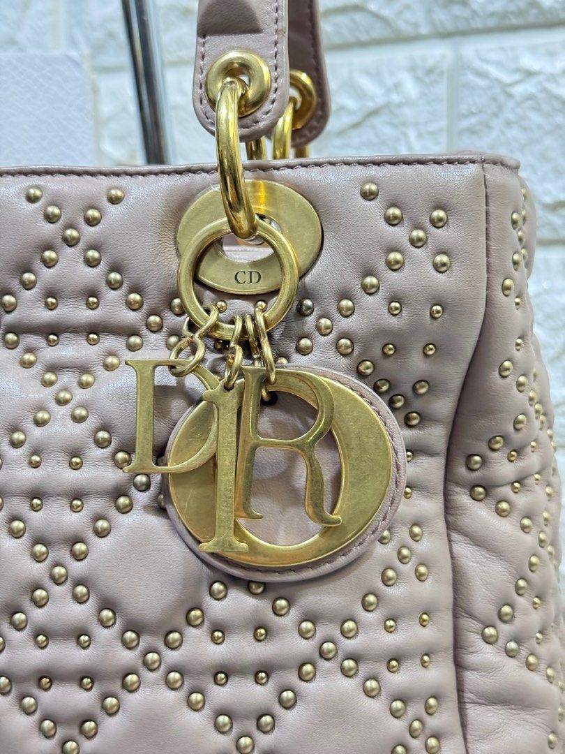 Lady Dior in Nude Soft Lambskin (Category: Luxury Bags & Wallets) located in Quezon City. Submitted by christineboller (Listing ID 1339313753, Image 3). Description: Small Lady Dior in Nude color. Soft crinkled lambskin leather comes with leather strap, luxurious suede-lined interior with zip pocket. Very clean interior, no rubs or scratches. GHW hardware still has its protective film. Serial Number 16-BO-0127 in dimensions 9.25”L x 4.5”W x 8”H. 