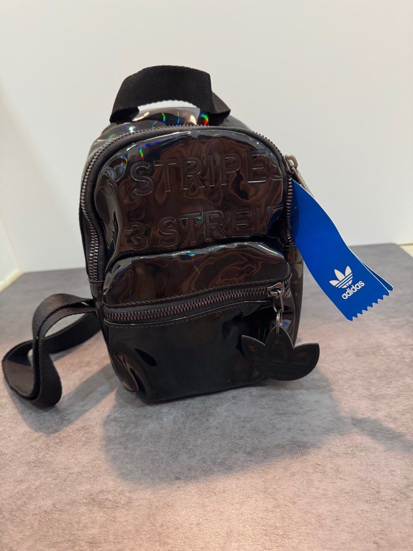 Mini Backpack (Category: Backpacks) located in Singapore. Submitted by wang_wang88 (Listing ID 1339278090, Image 1). Description: Adidas Originals Black Mini Backpack Brand new with tag Dimensions: 4” x 6” x 8” 100% polyester twill Front zip pocket Oversize zipper pull on main compartment Adjustable shoulder straps Carry handle Product colour: Black.
