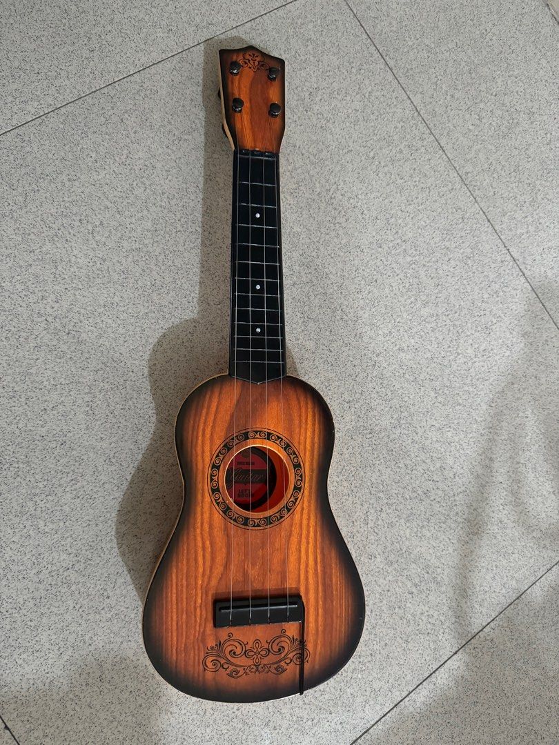 Mini guitar (Category: Musical Instruments) located in Mandaluyong City. Submitted by winx3 (Listing ID 1339224623, Image 1). Description: .
