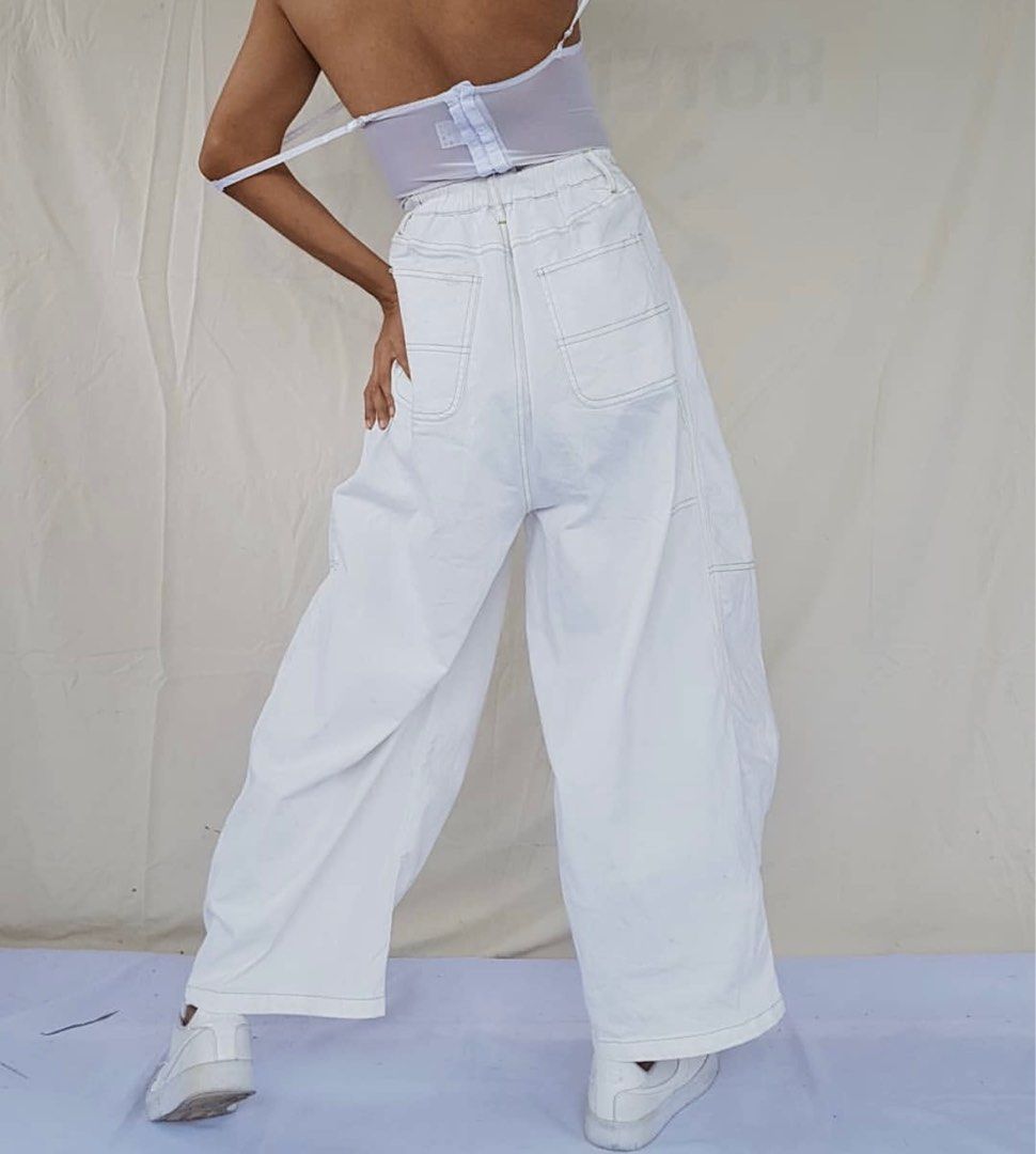 White Wide-leg Jeans (Category: Jeans) located in Taguig. Submitted by stxff_ (Listing ID 1339338211, Image 3). Description: Wide-leg white denim jeans with green contrast trim Size: M-L with adjustable drawstring inside Best for heights taller than 5’3, it’s a bit long.