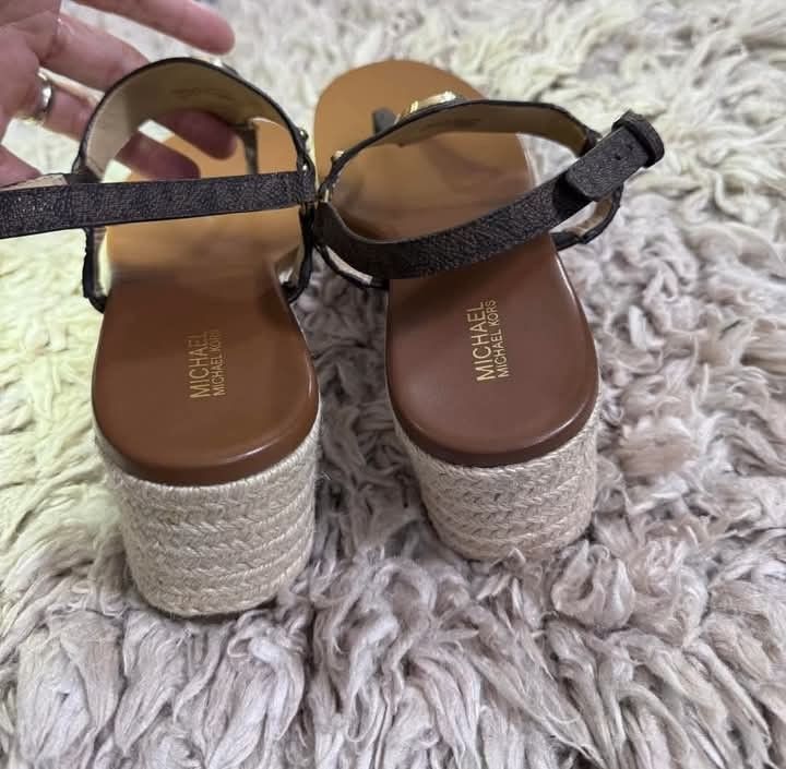 MK sandals like new with tag size 9 (Category: Luxury Apparel) located in Manila. Submitted by luis3191 (Listing ID 1340949359, Image 3). Description: Michael Kors Casey Signature Logo Leather Wedge Espadrille Sandals - size 9 ✅ Brand new ✅Leather upper with signature MK hardware ✅Buckle closure ✅Synthetic lining ✅Rubber outsole ✅Approx. 2.5" wedge height ✅Approx. 1" platform height.