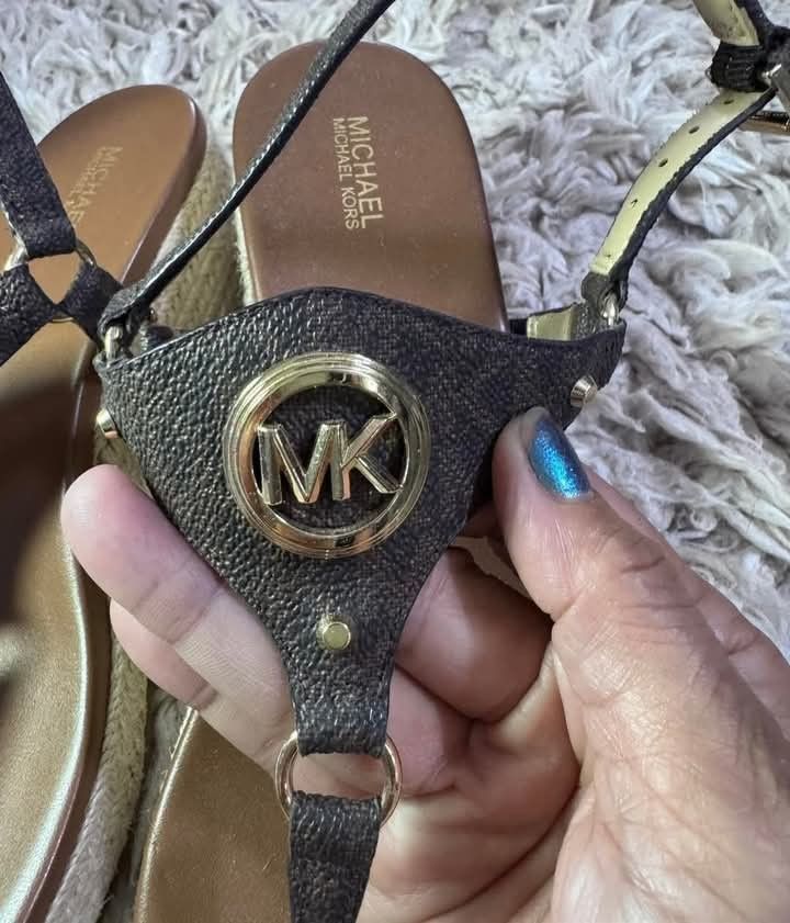 MK sandals like new with tag size 9 (Category: Luxury Apparel) located in Manila. Submitted by luis3191 (Listing ID 1340949359, Image 2). Description: Michael Kors Casey Signature Logo Leather Wedge Espadrille Sandals - size 9 ✅ Brand new ✅Leather upper with signature MK hardware ✅Buckle closure ✅Synthetic lining ✅Rubber outsole ✅Approx. 2.5" wedge height ✅Approx. 1" platform height.