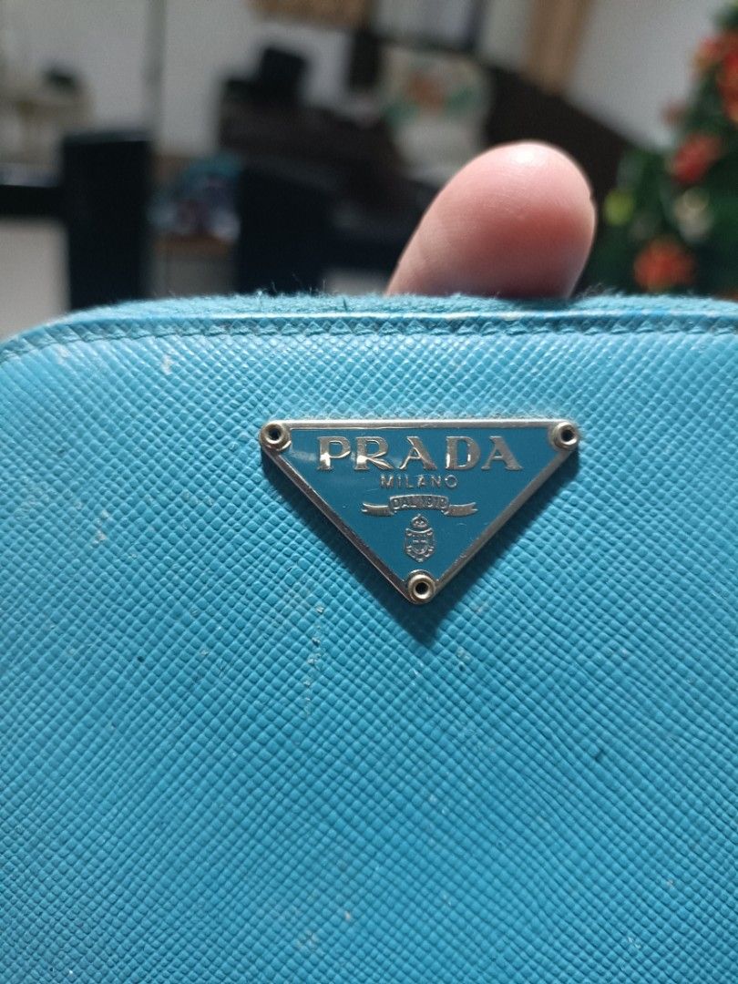 Prada Wallet Original Authentic (Category: Luxury Bags & Wallets) located in Gapan. Submitted by prelovedstuff32 (Listing ID 1340965348, Image 2). Description: authentic/ original prada mini wallet ..last price posted free shipping ..hindi po ito brand new pero sure na original at maganda pa lampo zipper pero di ko makunan pic dahil mahirap pic ung likod ng zipper ng wallet.