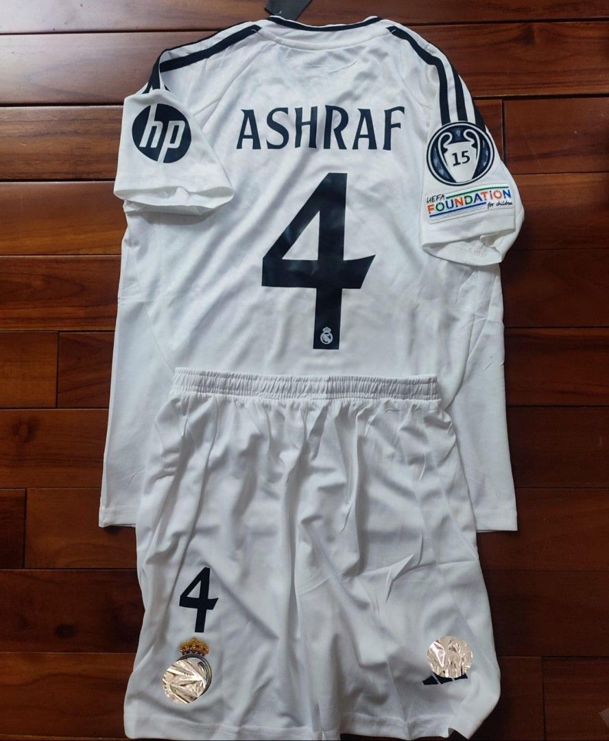 Real Madrid home kids custom name and number with patches jersey (Category: Babies & Kids Fashion) located in Singapore. Submitted by sgapparel (Listing ID 1340870014, Image 1). Description: jersey comes with tagged material:drifit size 16-28 Item send using register mail takes 2-3 working days.