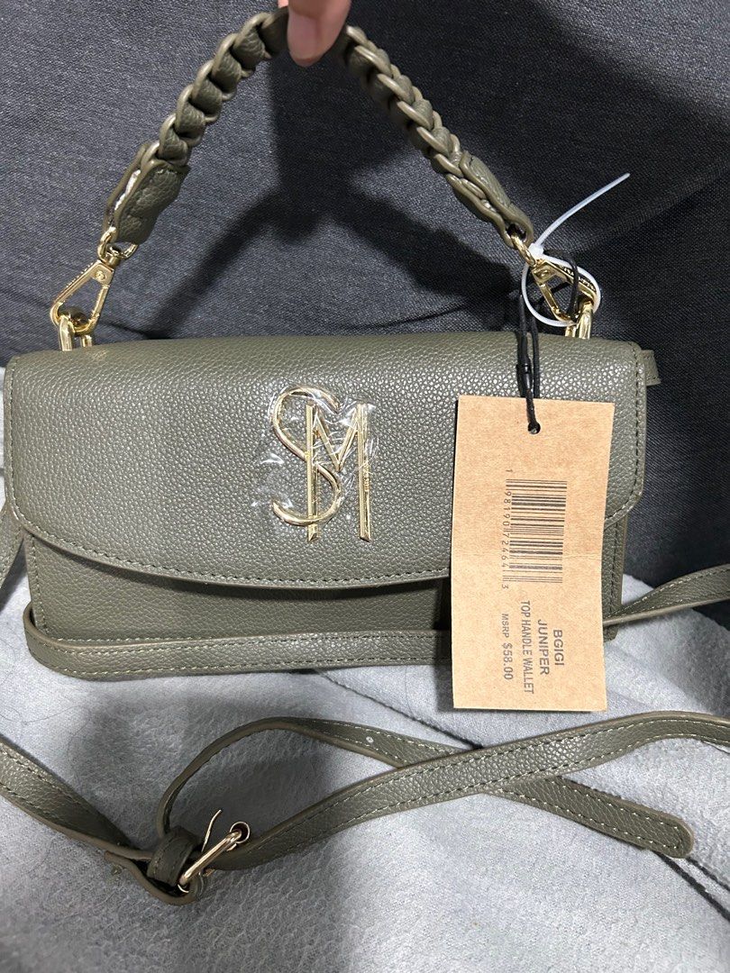 Steve Madden Top Handle Wallet/Minibag (Category: Luxury Bags & Wallets) located in Pasig City. Submitted by jansy024 (Listing ID 1341015099, Image 1). Description: Steve Madden BGIGI JUNIPER TOP HANDLE WALLET Navy green (very nice and versatile color) Minibag/Purse/Wallet with mini handle and long strap (as shoulder/body bag).