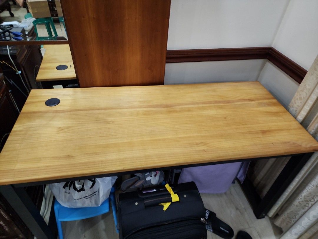 Study Table (Category: Tables & Sets) located in Singapore. Submitted by athrunz01 (Listing ID 1340994542, Image 2). Description: 2 study tables for sale L (140cm) B (60cm) H (70cm) 1 table has cut out (for wires) in centre and other table has cut out at the left side. self collection only.