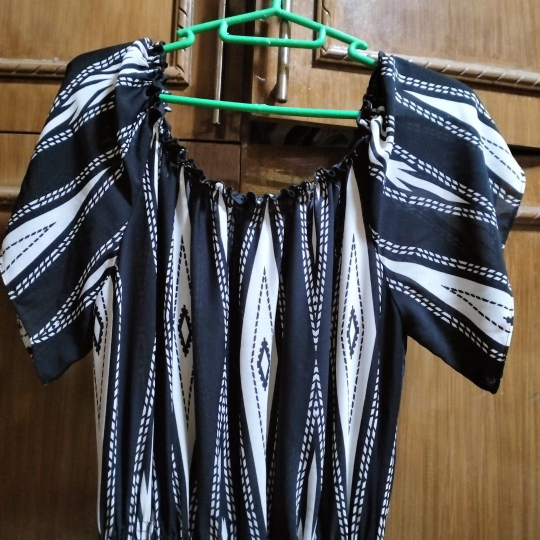 BLACK AND WHITE JUMPSUIT (Category: Jumpsuits) located in Manila. Submitted by her_itemsph (Listing ID 1341055533, Image 1). Description: ~ 👋Hi, do you wanna feel like a diva while walking at the beachfront? Well then, this jumpsuit is made exactly for that scene! Try on this and feel the beach-y vibe with a bit of drama! 😎 Brand: Genevieve Type: Jumpsuit, Flowy, Fabric is Medium-Thin, It also has some small cuts on both sides of the bottom for