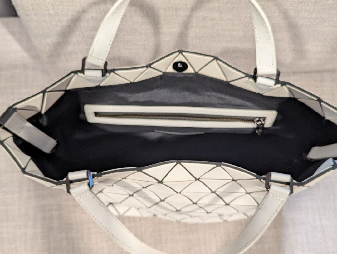 BNEW Baobao Issey Miyake matte white (Category: Luxury Bags & Wallets) located in Quezon City. Submitted by vert1cal (Listing ID 1341051983, Image 3). Description: BNEW Baobao Issey Miyake matte white With removable strap 16.5" length 10" height (14" if with handle) 5.5" depth Includes dust bag and cards.