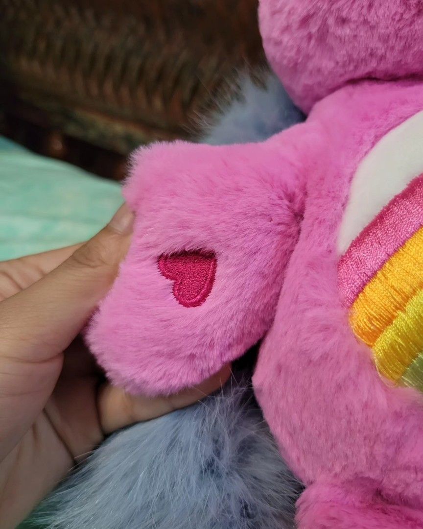 Official Cheer Bear Care Bears plush OG design (Category: Plushies & Soft Toys) located in Baguio. Submitted by tinkerjoystudio (Listing ID 1341097561, Image 3). Description: Cheer Bear 13" plush ♡ official from Korea 🇰🇷 w/ clear etiketa ♡ Hard glitter eyes, heart nose & heart butt cheek ♡ no flaws, no discoloration, fluff intact furry!! ♡ detailed embroidery 🧵🪡 ♡ kinda hard to find na, OG design t. carebears pink medium plush stuffed toy hug