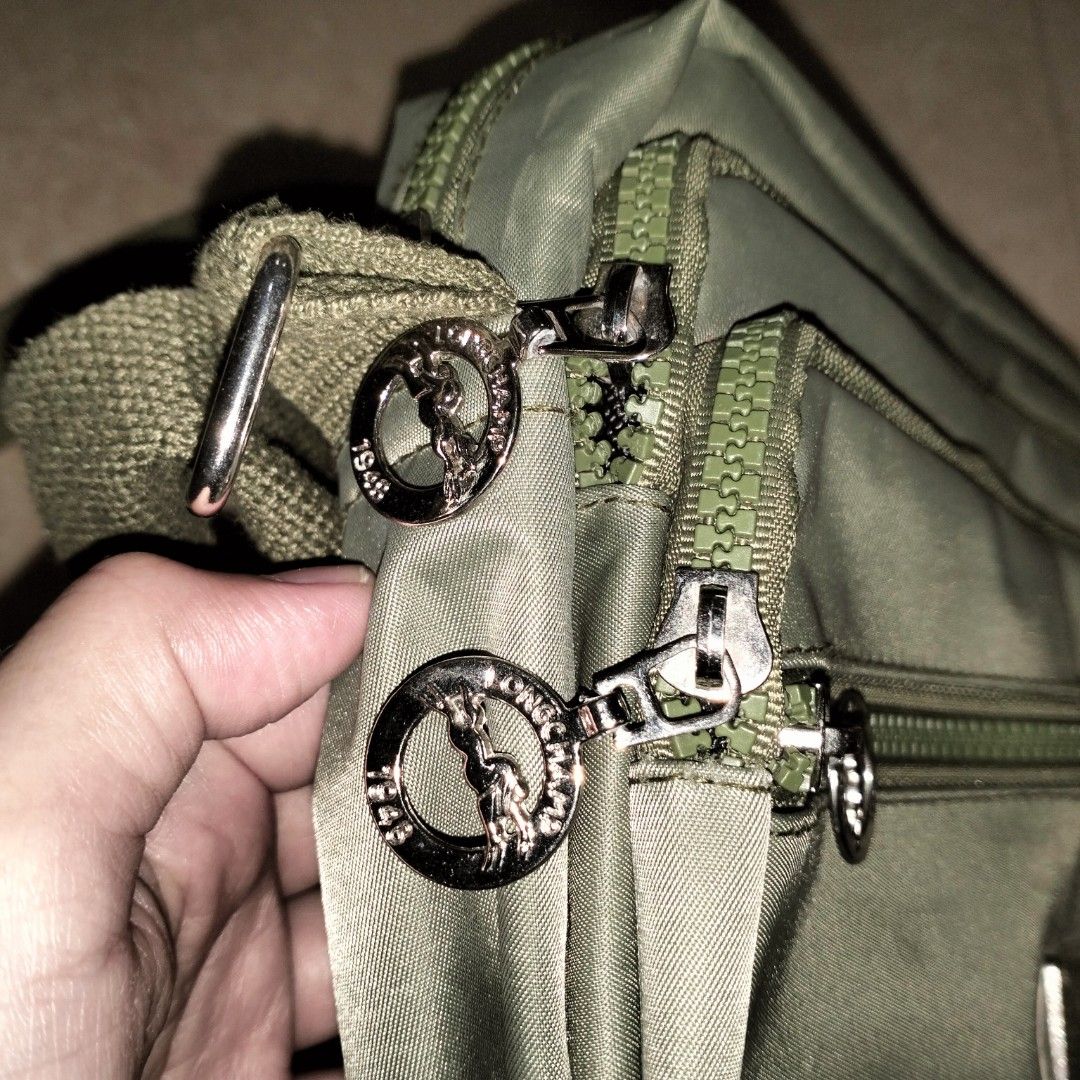 DARK GREEN BAG (Category: Sling Bags) located in Manila. Submitted by her_itemsph (Listing ID 1341057130, Image 2). Description: ~ 👋 On the run to the wet market or just going to the park for some air? Then, you need a bag for some stuff you might want to carry with you! 🛍️ Here's a simple green bag that can help you for that! Brand: Locally made Size: Small Color: Dark Green Details: Has 3 compartments, can fit a small or single-medium-sized (