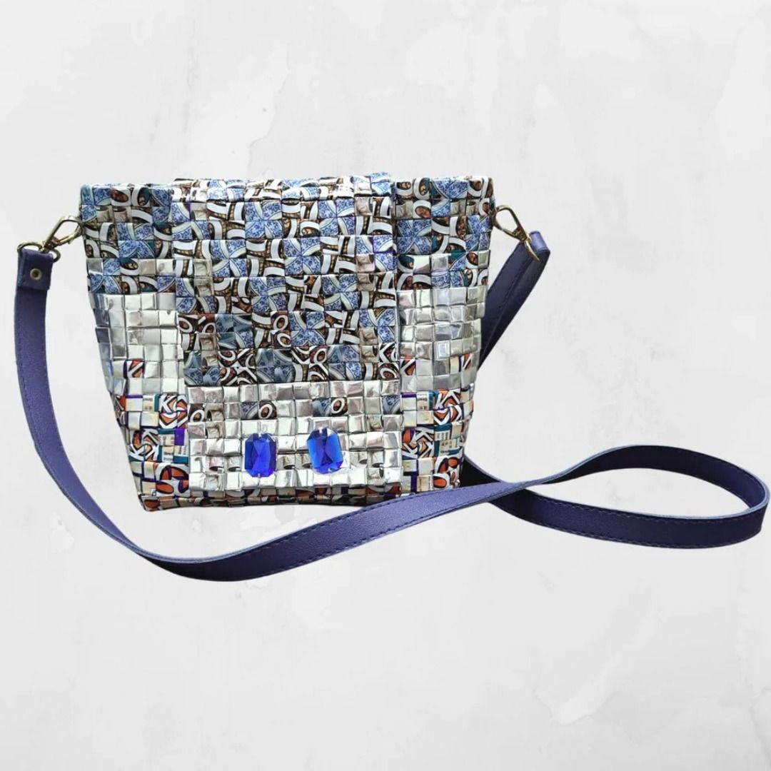 Blue Moonbeam - Upcycled Sling Handbag (Category: Cross-body Bags) located in Singapore. Submitted by bcaresg (Listing ID 1341319391, Image 1). Description: Upcycled bag made from recycled plastic Dimensions: Width: 24 cm, Height: 19 cm This unique handbag is a true piece of art, handcrafted using recycled materials. Its stunning mosaic-like design features vibrant colors and textures, making it both sustainable and stylish. Perfect for eco-consc